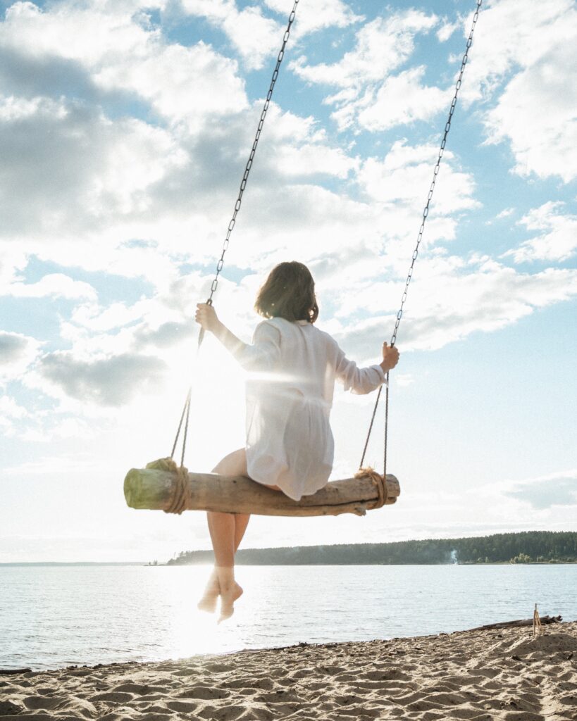 Happy woman swinging